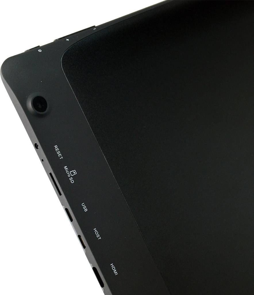 A black device with connections for reset, microSD, USB, HDMI and headphones, shown on an angled surface.