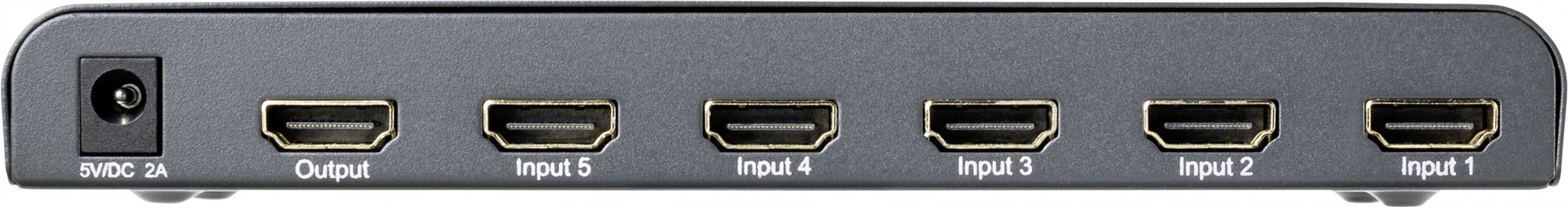 An HDMI switch with six ports, labelled as 'Output' and 'Input 1-5', allows switching between multiple input sources.