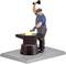 A man in workwear is forging iron on an anvil and striking it with a hammer. The iron glows yellow from the heat.
