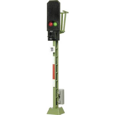 A green and red railway signal on a green mast with the number 11 on the front, indicates clearance and stop conditions.