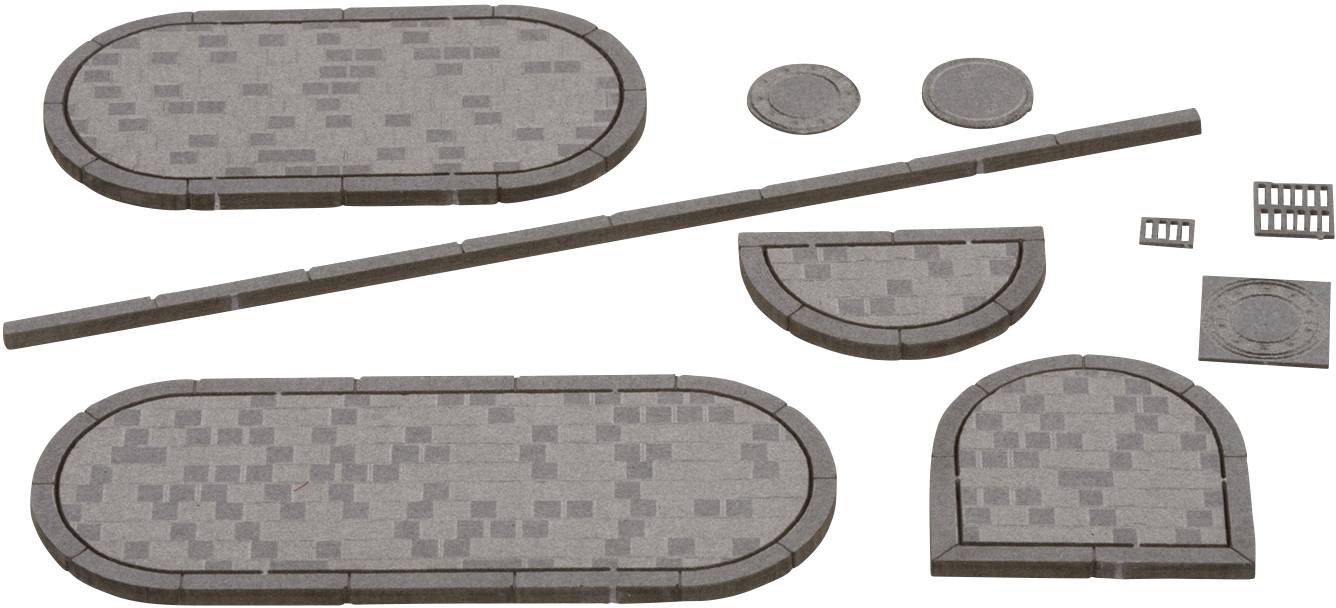 Kit of grey paving stone pieces in various shapes and sizes, ready for assembly. Contains oval and round stones as well as strips.