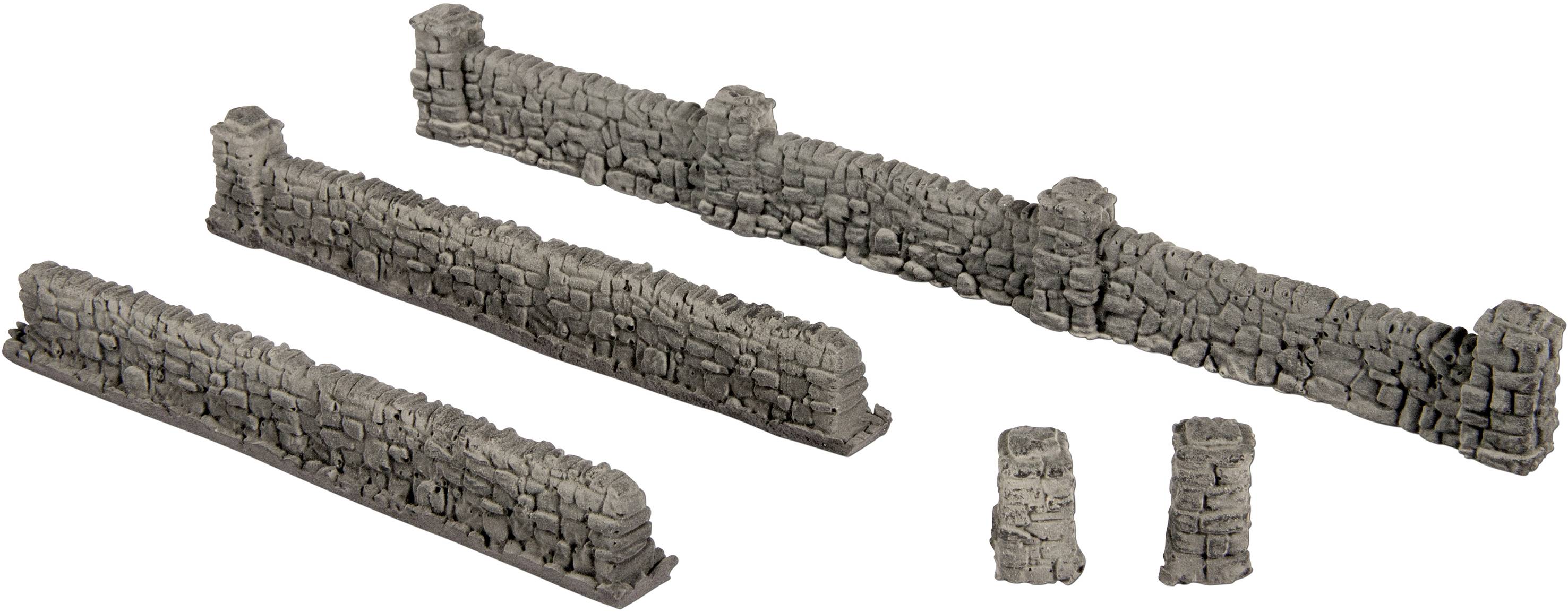 Three grey, modelled stone walls of varying lengths and two freestanding stone columns reminiscent of ruins.