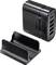Black USB charging station adapter with four ports next to a matching stand, ideal for simultaneously charging multiple devices.