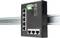 A black Ethernet switch with multiple ports is mounted on a metal rail. Green connection terminals are located on the top.