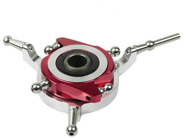 A silver and red mechanical component with three symmetrical arms. Likely part of a technical or industrial device.