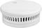 Round, white smoke detector with ventilation slots, suitable for ceiling mounting to detect smoke and warn of fire.