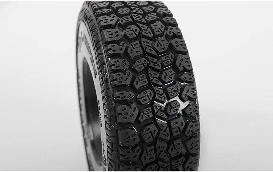 A single winter tyre with deep, detailed tread against a grey background. The tyre displays a robust structure.
