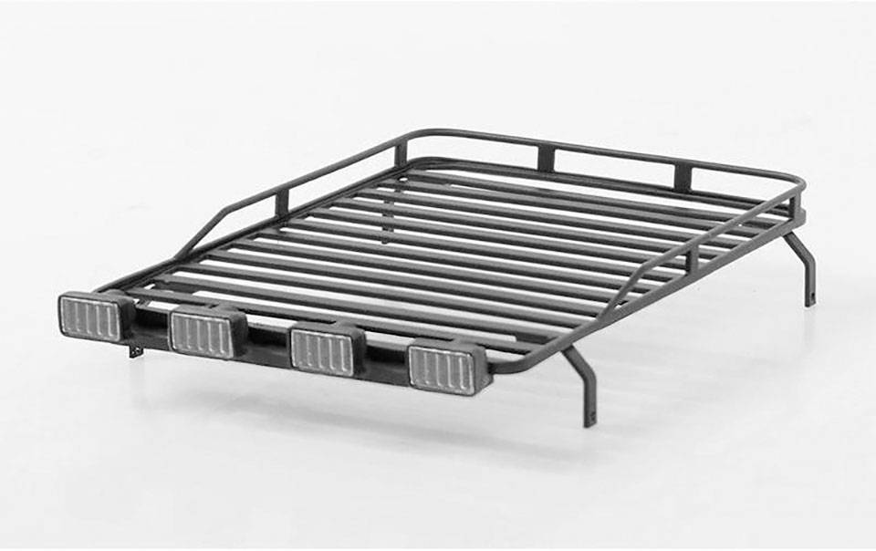 Metal roof rack with four attached headlights, designed in a grid-like pattern, on a white background.