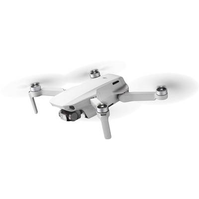 A white quadcopter drone hovers in the air. It has a camera on its front and is suitable for aerial photography.