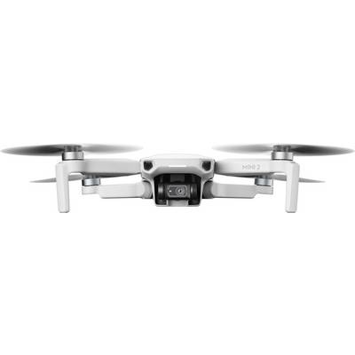 White drone with a camera at the front flying in the air.