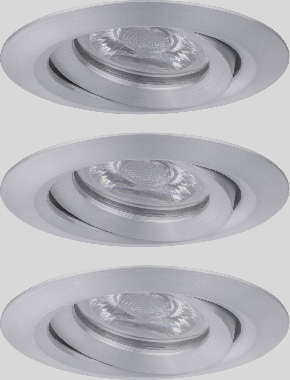 Three round, adjustable recessed lights made of silver metal in a vertical row.