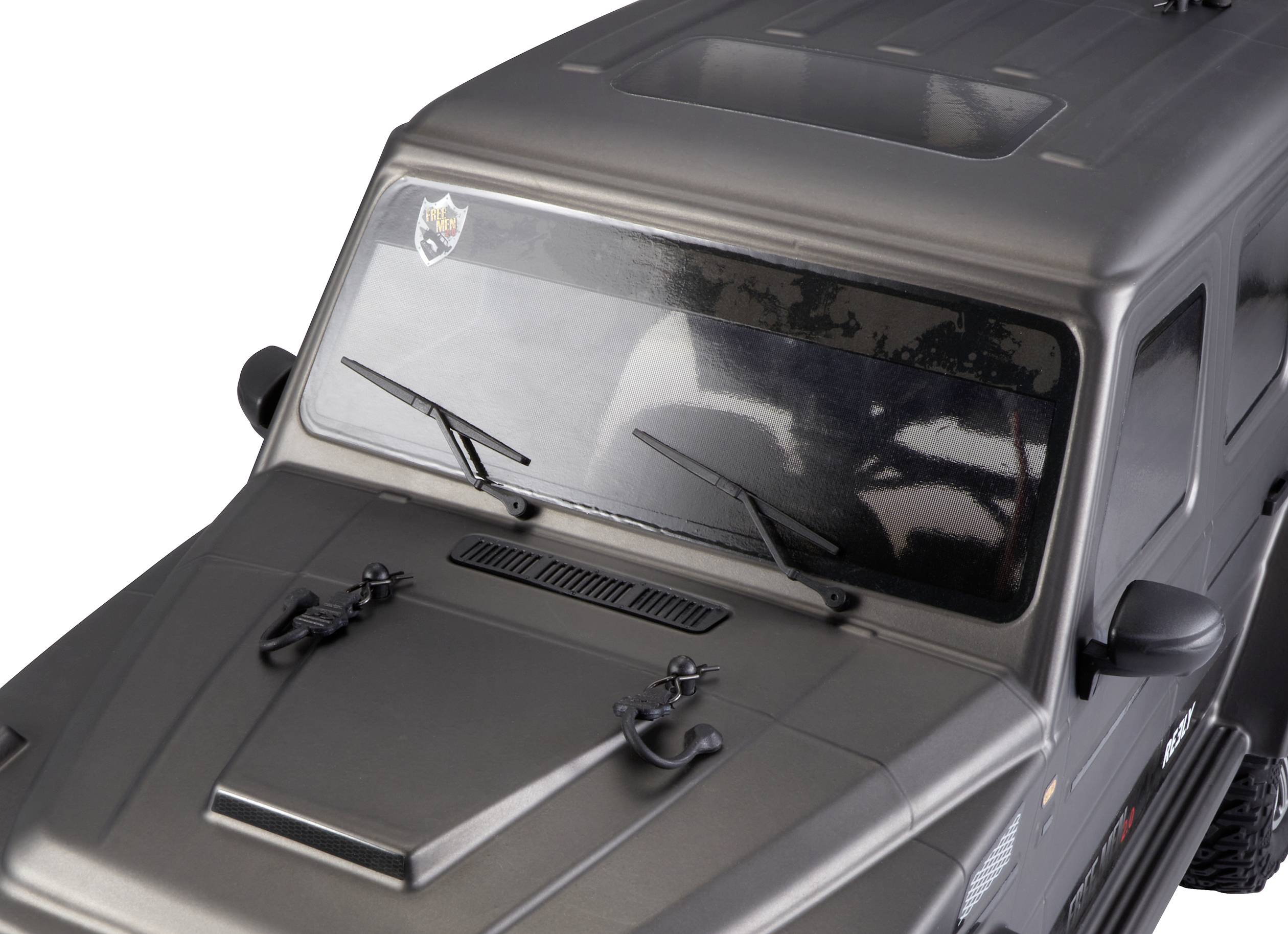 A black model car with angular design, viewed from above. The vehicle has black windscreen wipers and an emblem on the windscreen.