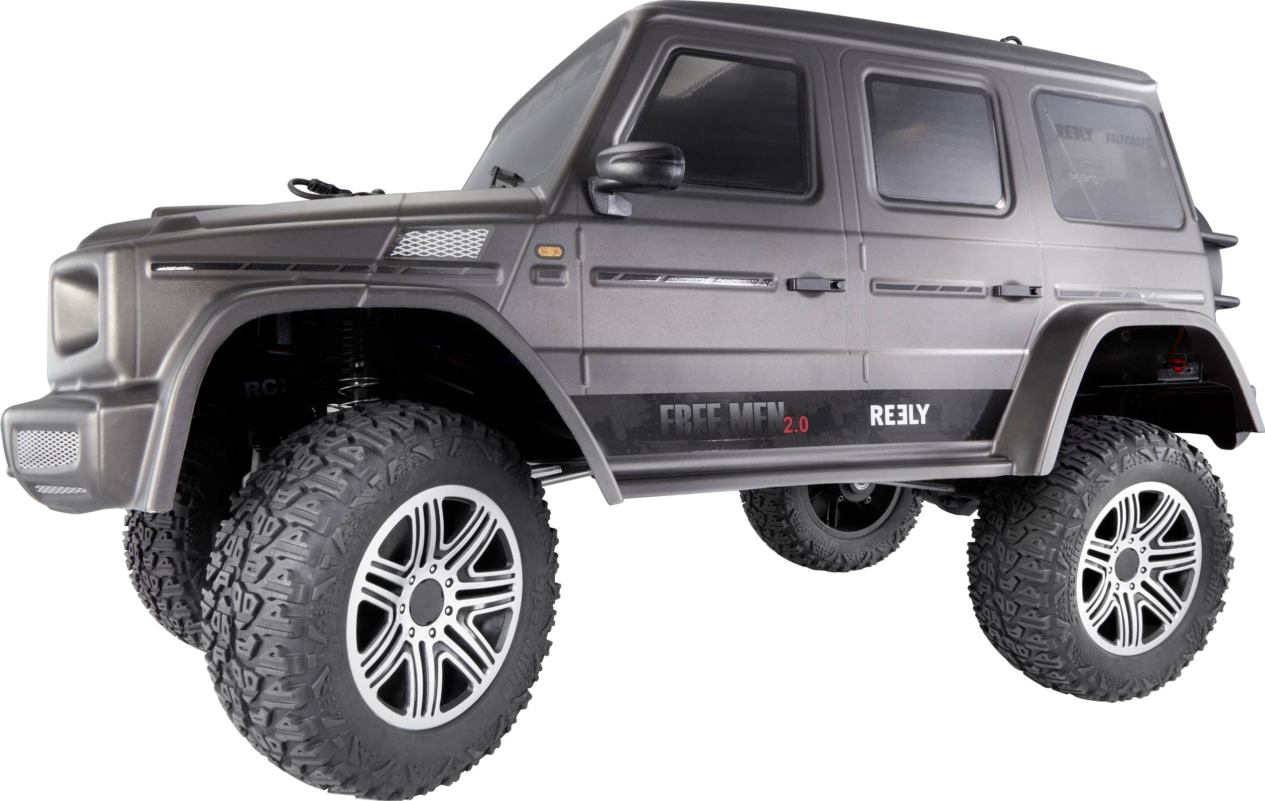 A remote-controlled model car in SUV form with large tyres and a grey bodywork with 'Free Men 2.0' written on it.