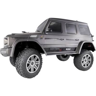 A remote-controlled model car in SUV form with large tyres and a grey bodywork with 'Free Men 2.0' written on it.