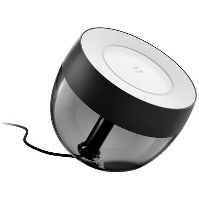 Black Philips Hue table lamp with a transparent housing, connected to a black cable.