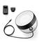 Round, transparent speaker with black rim, cable and two plug adapters.