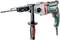 A Metabo electric drill with an ergonomic handle and additional support grip, suitable for DIY projects.