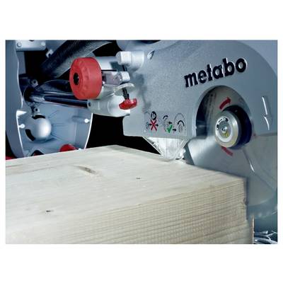 A power saw cutting a wooden plank, showing saw blade and safety instructions on the machine.