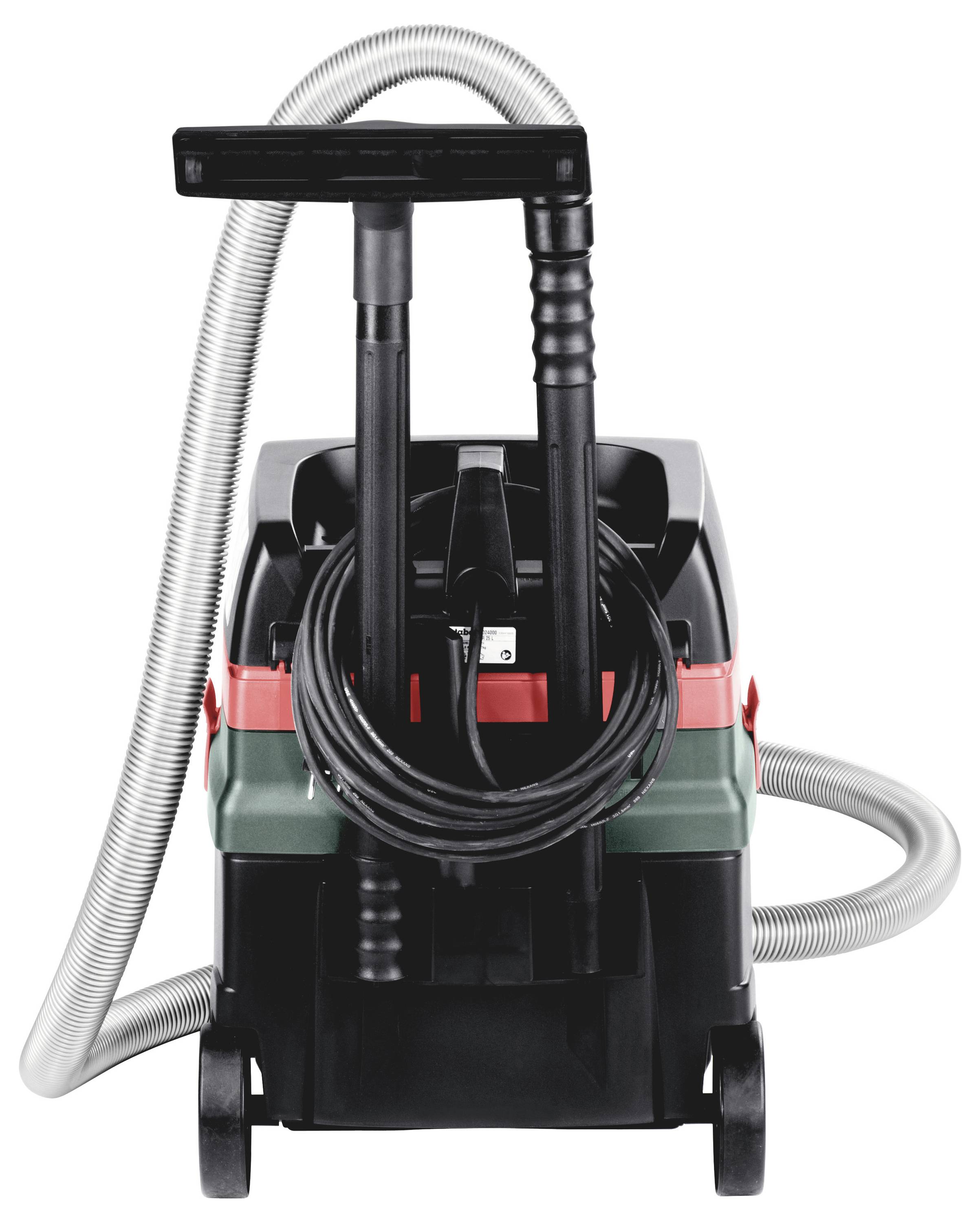 A compact, portable carpet cleaner with a gray hose, black wheels, and a handle. The device is primarily black and green with red accents.