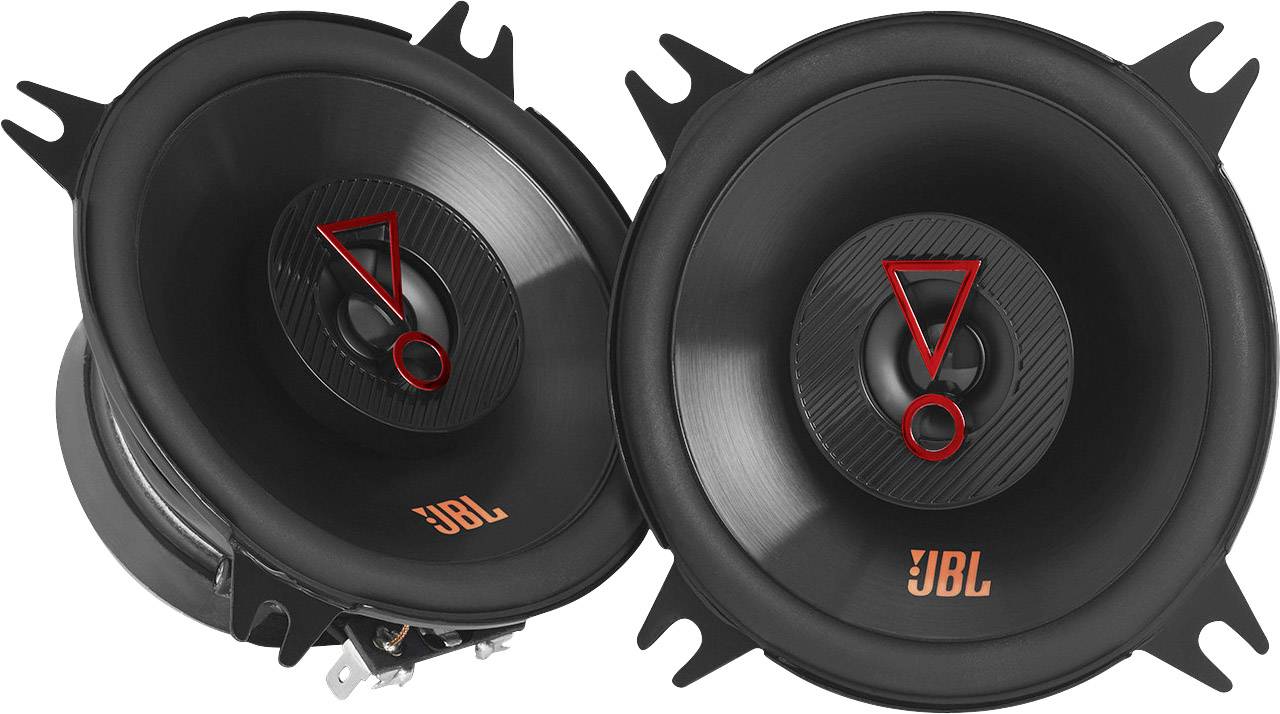 The image shows two black speakers with an orange 'JBL' logo. They are angled upwards and have red markings in the centre.