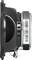 Side view of a speaker with a black cover and a visible barcode on the back, cable connections at the bottom.