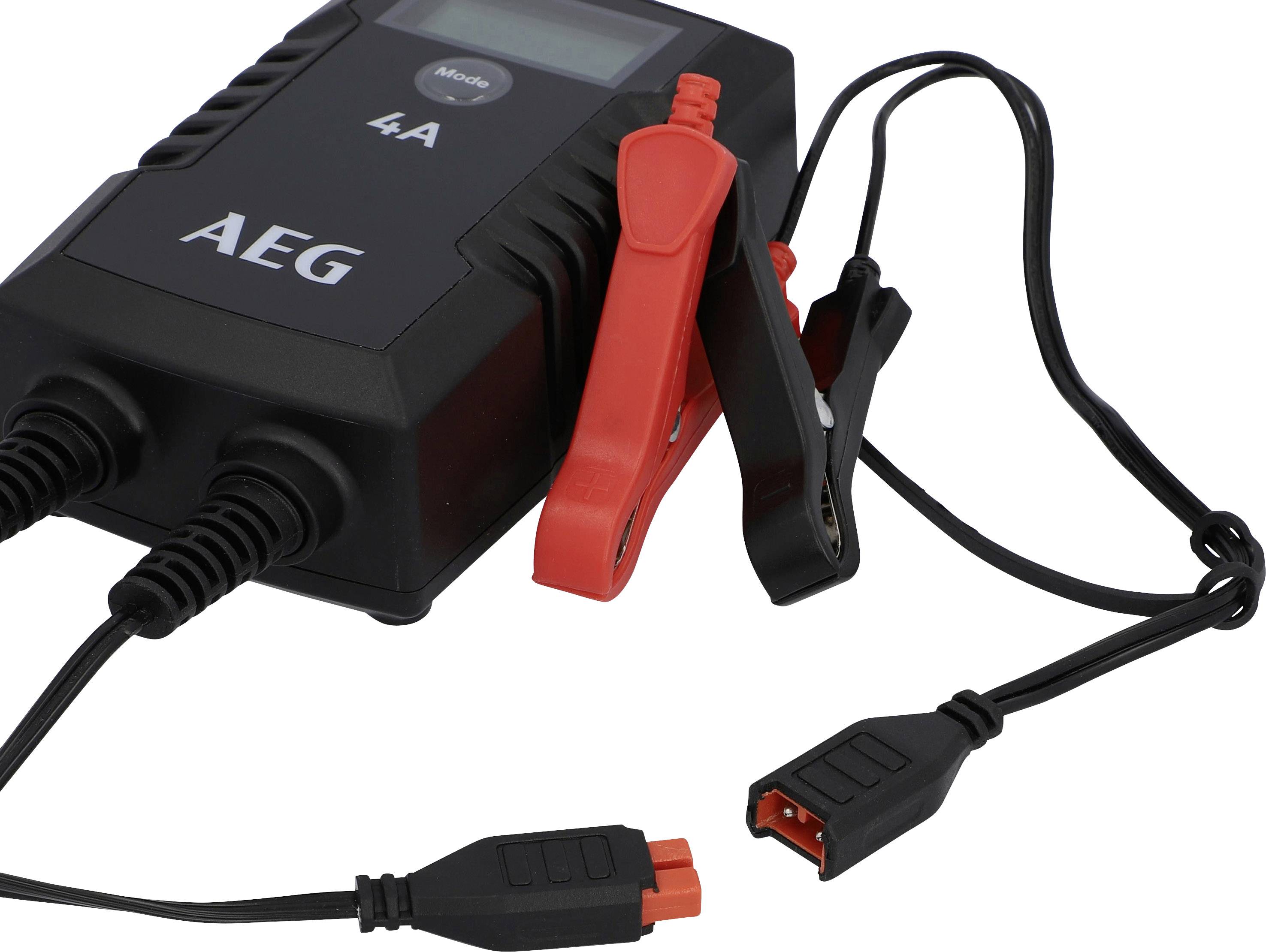 Battery charger with two cables and crocodile clips, AEG brand, ready to charge a car battery.