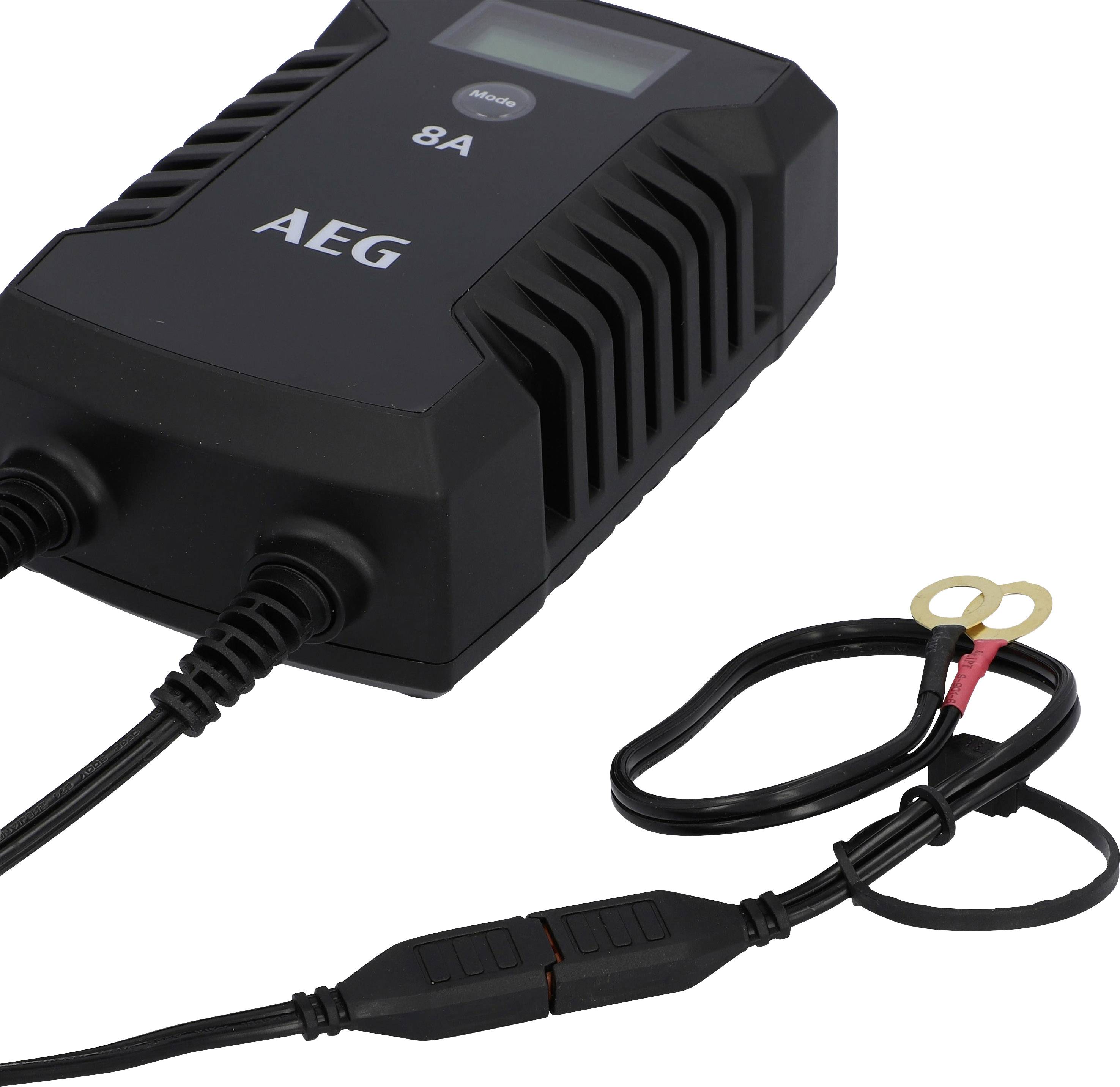 Black AEG battery charger with display and cables, suitable for charging car batteries and other devices.