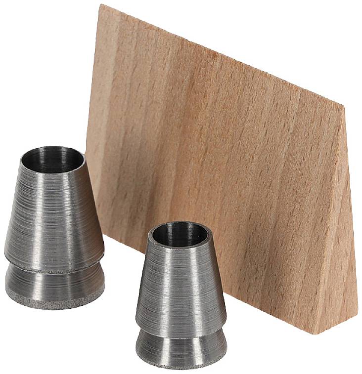Two conical metal objects stand beside an angled piece of wood. The arrangement could be part of an experimental design or a sculpture.