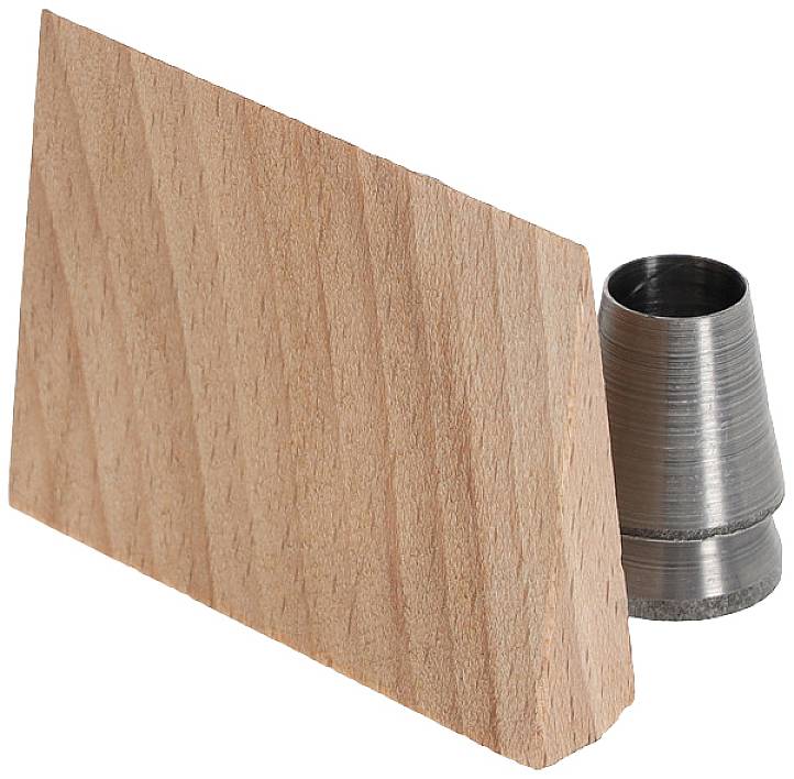 A slanted piece of wood stands next to a cylindrical metal object that could potentially serve as a mount or attachment.