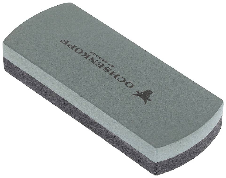 Grey grinding or polishing stone with a logo on the surface, used for sharpening or abrading materials.
