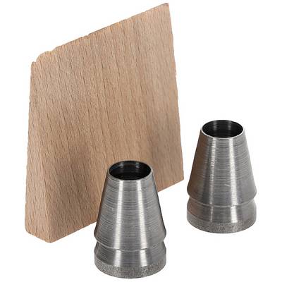 Metal fittings in front of a wooden board.