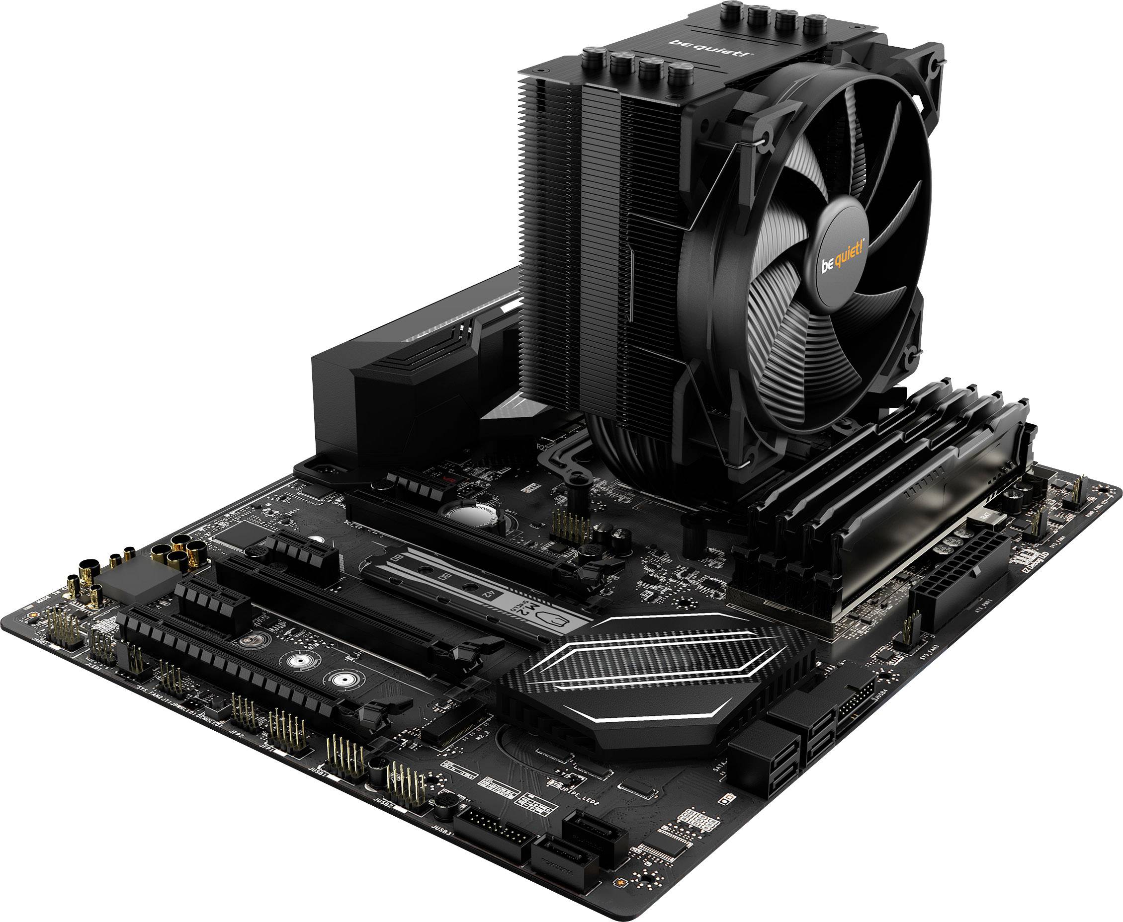 The image shows a motherboard with an installed CPU and large fan. Numerous ports and RAM slots are visible.