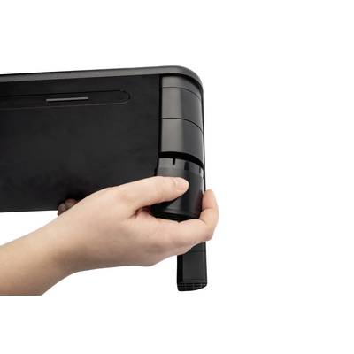 A hand is holding a table leg adjuster to adjust the table leg.