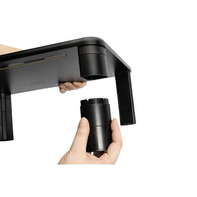'Close-up of two hands assembling plastic legs on a table. One hand holds the table edge, while the other attaches a leg.'