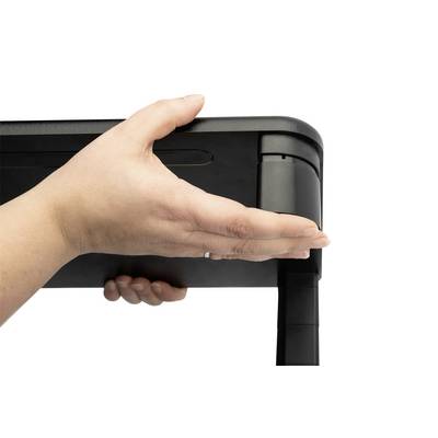 A hand holds the corner of a table, potentially demonstrating the table's stability or folding mechanism.