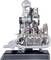 Transparent model engine on a black base; reveals internal mechanisms such as pistons, cylinders, and spark plugs.