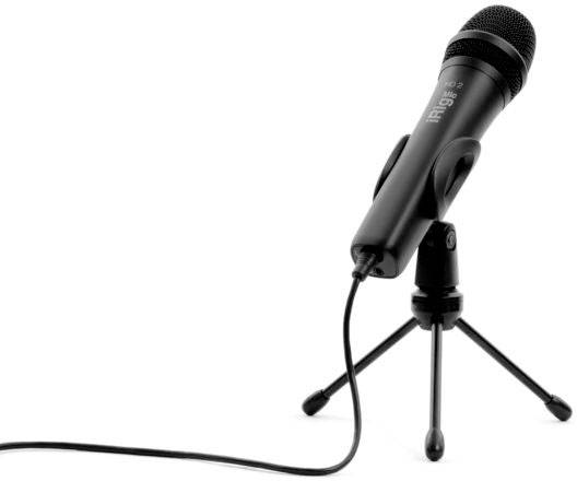 A black microphone on a stand, connected by a cable, is set up ready for an audio recording on a white surface.