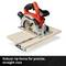 Angle grinder with guide on wooden board to demonstrate precise cutting technique.
