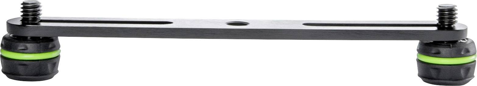 A black metal rod with two green, rubberised feet at the ends, presumably a damper mount or similar device.