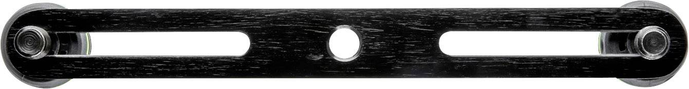 A black, rectangular object with two elongated openings and a round hole in the centre.