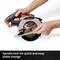 'A person is holding a circular saw, demonstrating its spindle lock for an easy saw blade change.'