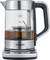 Electric glass tea kettle in stainless steel finish, Severin brand, with fill level scale. Tea container in the centre.