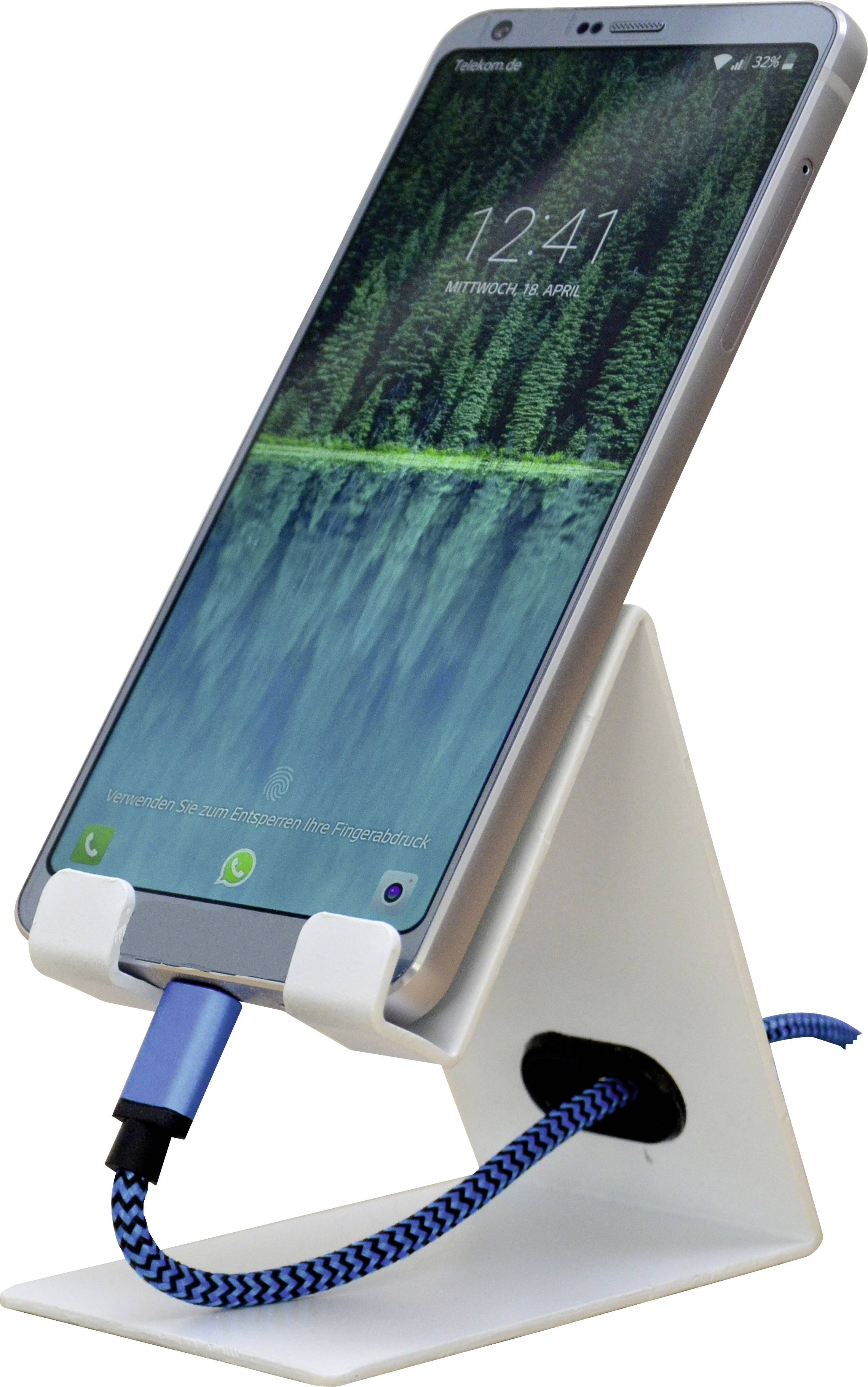 Smartphone on a white stand, displaying the time as 12:41 and the date. A blue charging cable is connected.