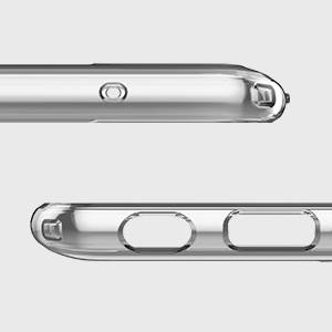 A transparent plastic component with openings and mounting elements, likely a housing element or frame for an electronic device.