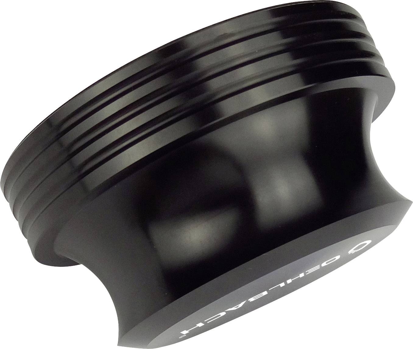 A black, cylindrical metal adapter with side grooves and an 'Öhlins' inscription is pictured.