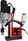 Magnetic drill with red housing, black electric motor, metal drill bit and coolant container; Model RU25 by Euroboor.