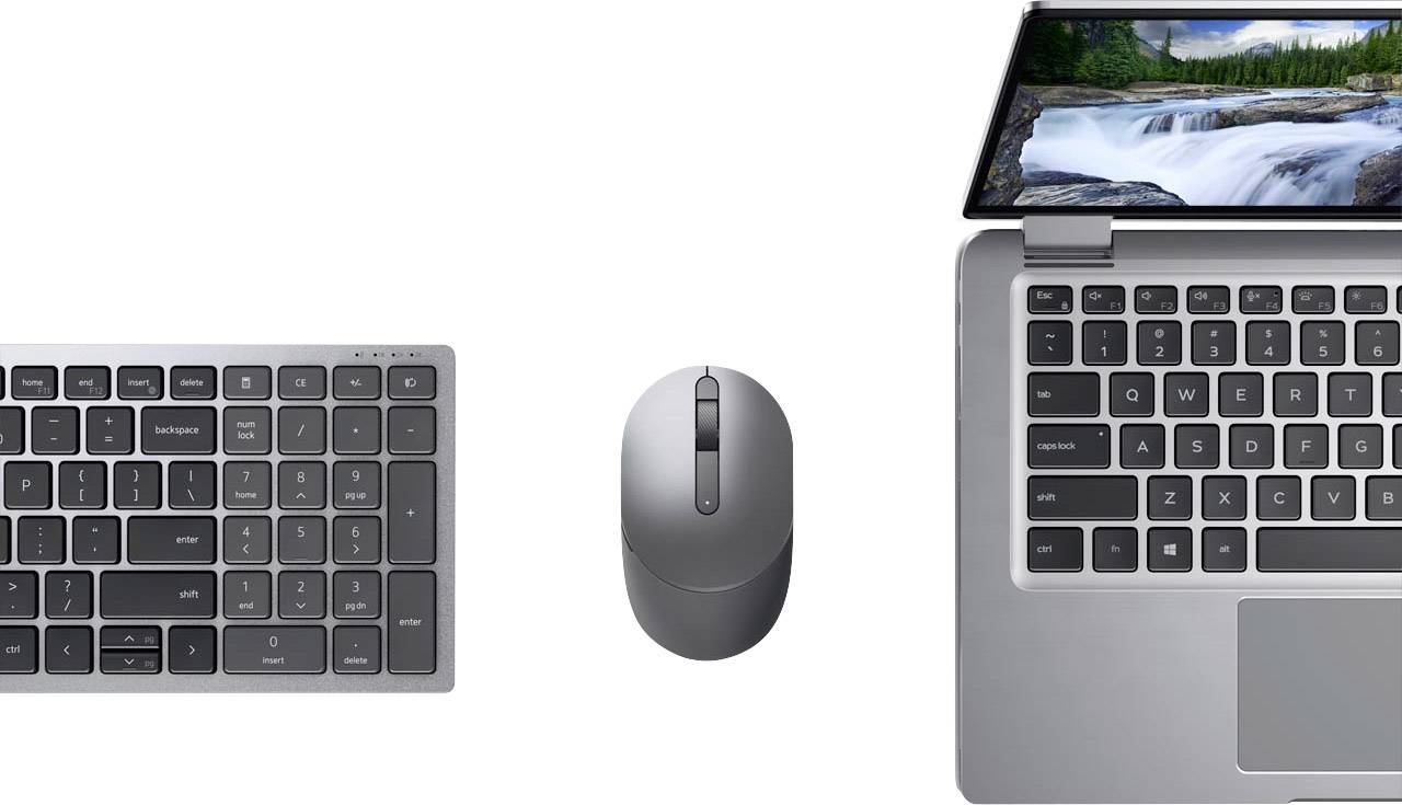 Keyboard, mouse and laptop from above. The laptop screen displays a waterfall.