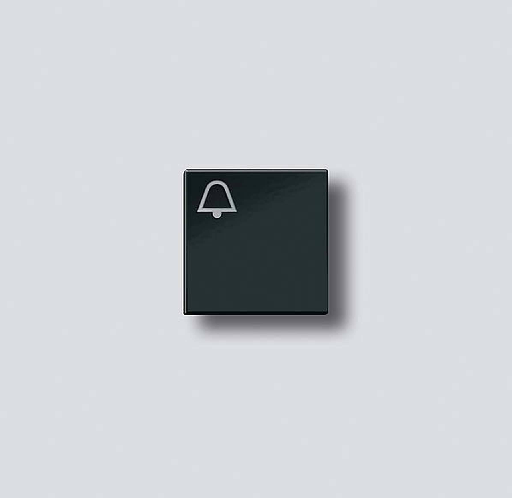 Black square with bell icon on grey background.
