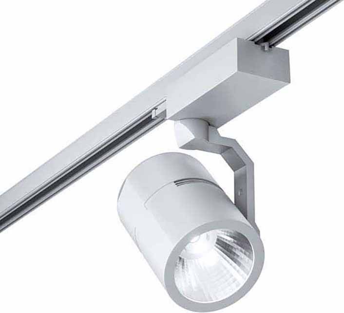 'Modern, cylindrical metal rail light mounted on a ceiling, casting bright light downwards.'