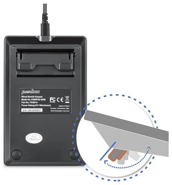 'Back of a wireless keyboard with a removable cover. Enlarged detail shows the locking mechanism of the cover.'